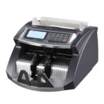 New Wave dark grey and silver heavy-duty cash bill counting machine with numeric keypad control panel and LCD screen, available at Data Cable Store Pakistan.